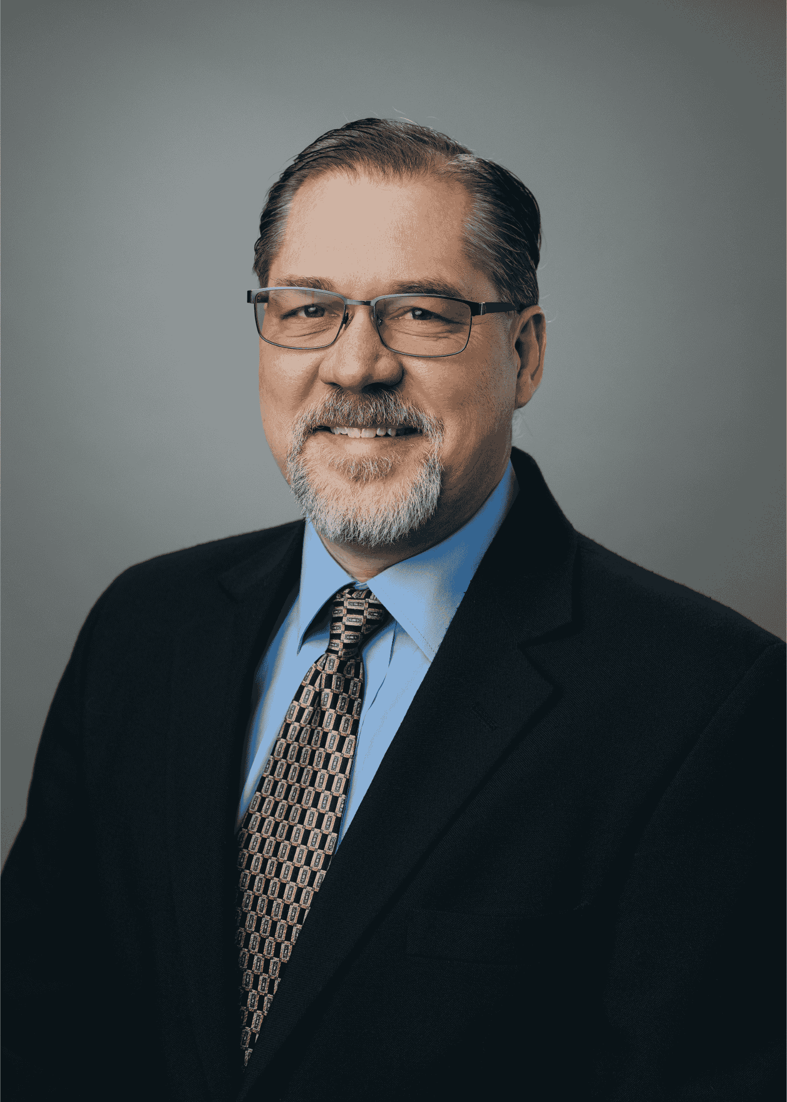 The is a headshot of Dr. Lloyd Metzger